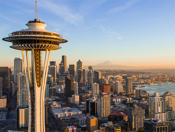 Aerial view of the cityscape in Seattle, Washington, with the Space Needle in the foreground.