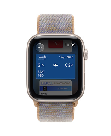 Apple Watch SE 3, aluminum case, starlight color, screen shows Wallet, payment card graphic, right side exterior, Digital Crown dial, Sport Loop band, chambray blue color (light blue-gray)