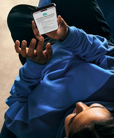 A person checks details of their possible sleep apnea alert on an iPhone