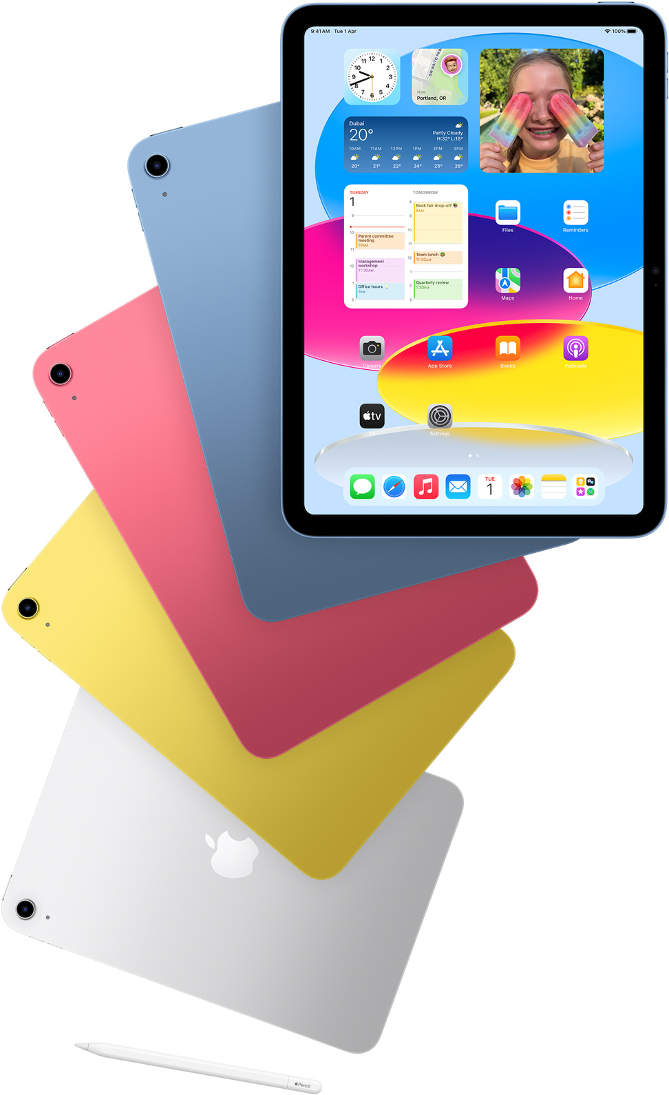 Front view iPad shows the home screen with blue, pink, yellow, and silver rear-facing iPads. An Apple Pencil sits nears the arranged iPad models.