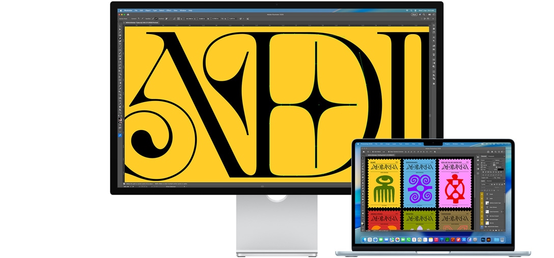 Studio Display and a Mac laptop showing a project being worked on in multiple Adobe programs, Studio Display shows a closeup on black text against a rich yellow background, the anti-reflective coating helps reduce glare