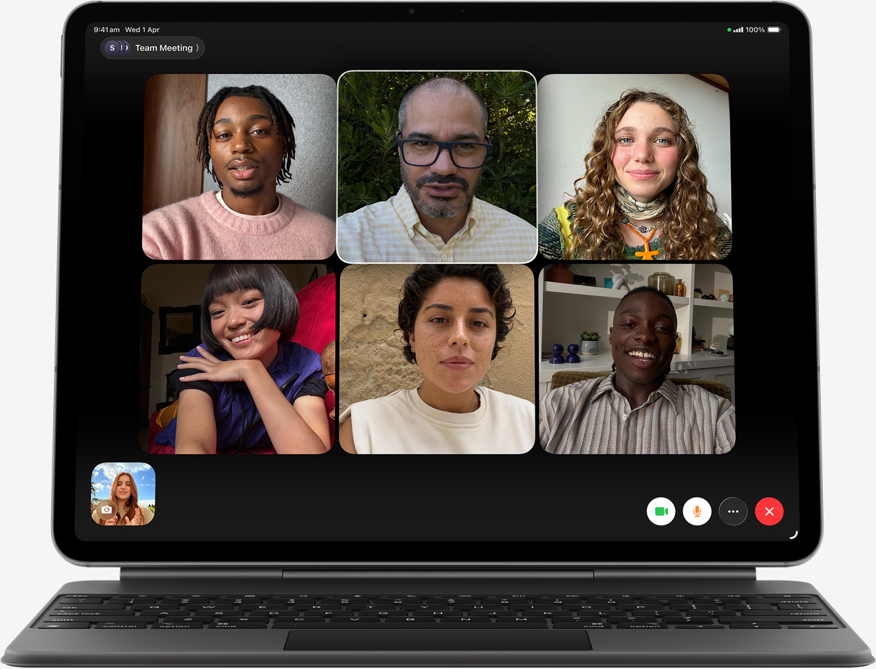 iPad Air, front exterior, Magic Keyboard, black colour, FaceTime call on the screen, multiple participants visible