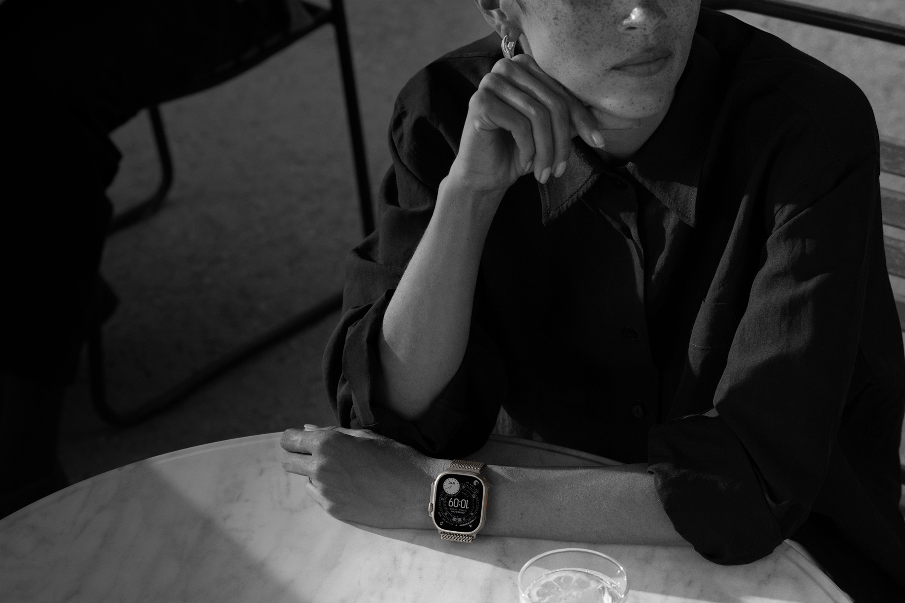 A person wears Apple Watch Ultra 3 while out to dinner