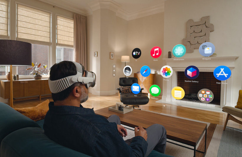 A user wearing Apple Vision Pro on a couch in a living room launching Home View