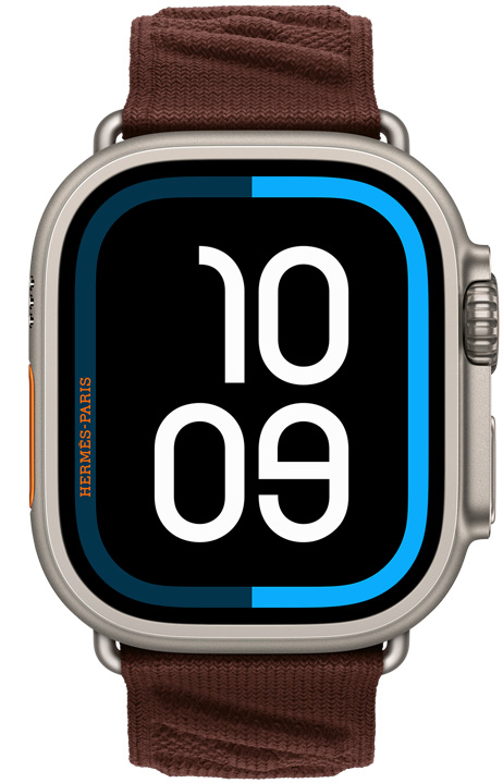Apple Watch Hermès Ultra 4, Maritime digital watch face, titanium case, natural colour, right side exterior, Digital Crown, raised side button, paired with En Mer band, Bordeaux colour (dark brown), textured knit material