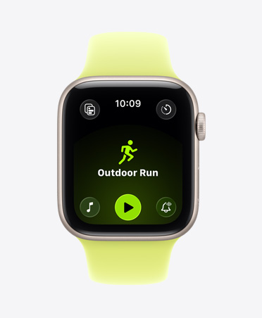 Apple Watch SE 3, aluminum case, starlight color, Outdoor Run workout open, Apple Music play controls at bottom of screen, Sport Band, neon yellow color